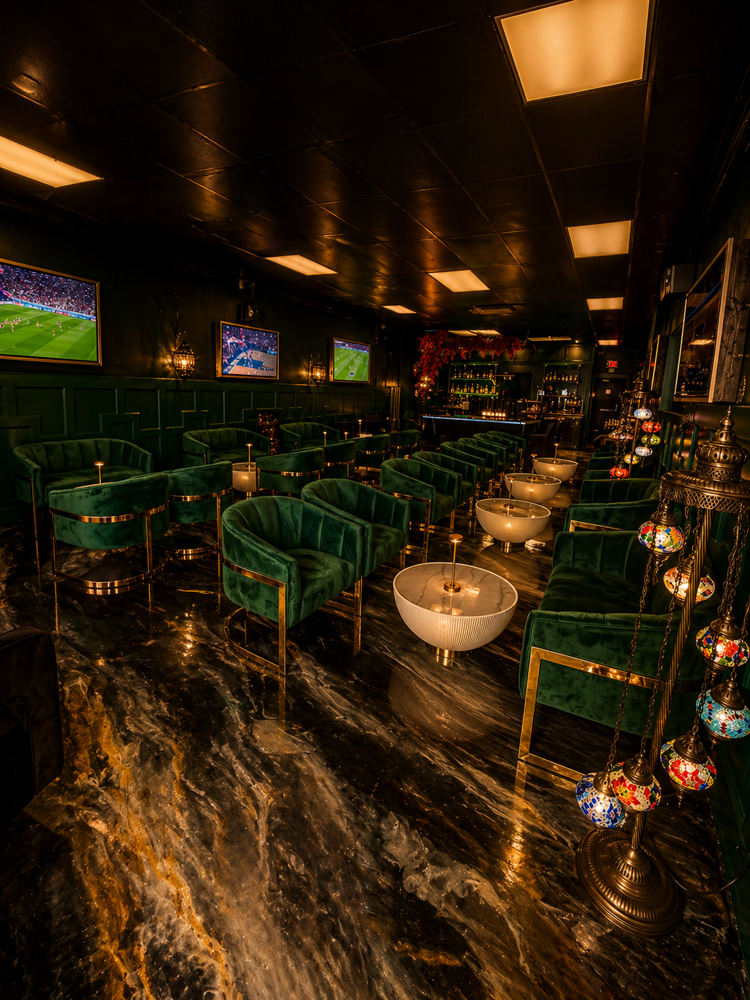 Emerald velvet seating with marble floors