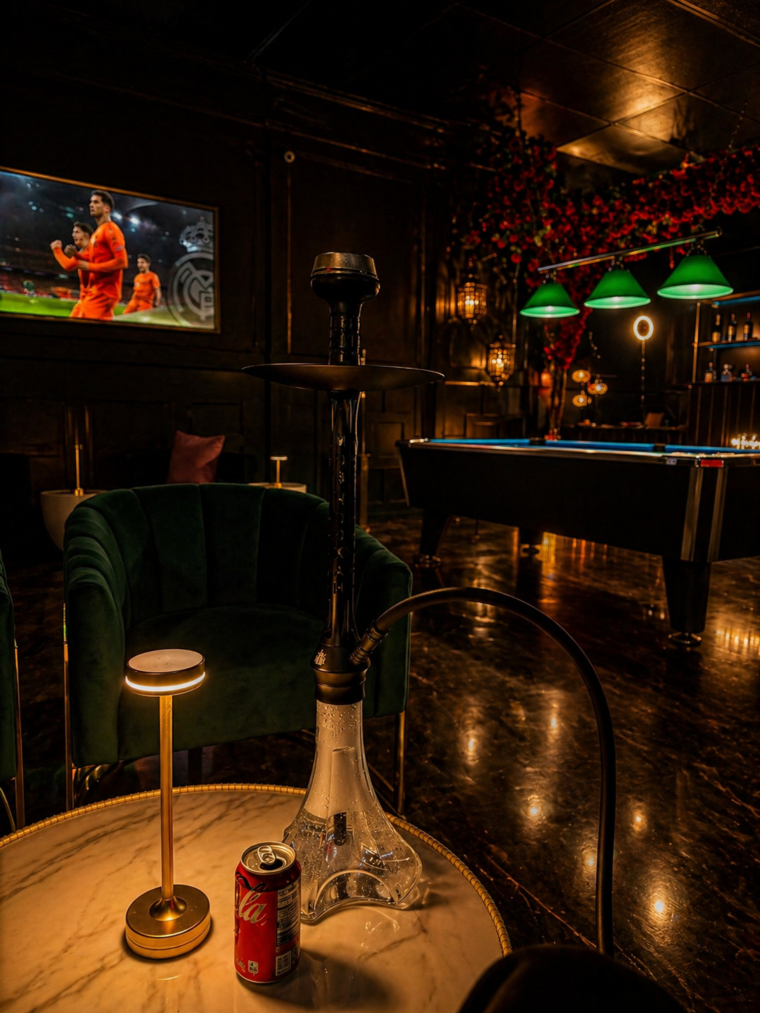 Pool table beside velvet lounge seating